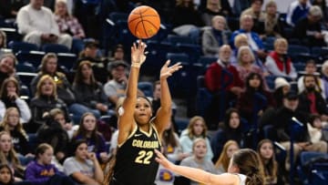 Proud parents cheer on Shelomi Sanders after scoring first points for the Colorado Buffaloes