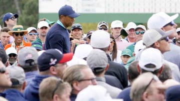 Tiger Woods' First Hole on Friday: Big Crowd, Navy Sweater, White Shoes, Bogey