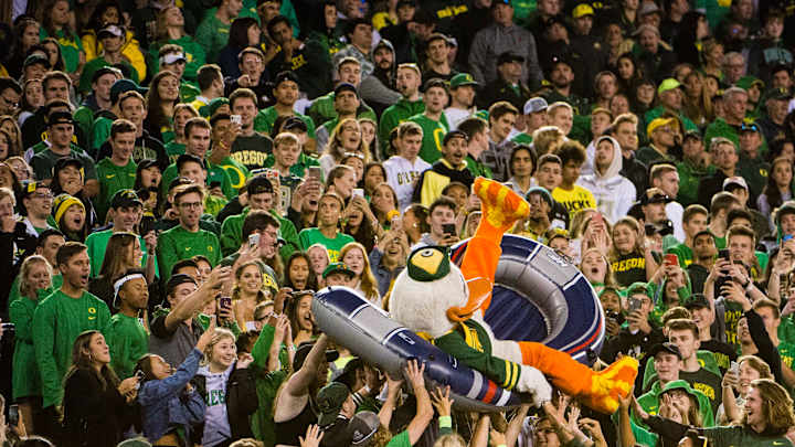 Oregon Fan Gets Loose on the Field, Taken Down by Ducks' RB Cyrus Habibi-Likio