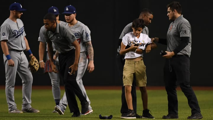 Fan Charged With Disorderly Conduct After Rushing Field at Dodgers Game Fan Charged With Disorderly Conduct After Rushing Field at Dodgers Game