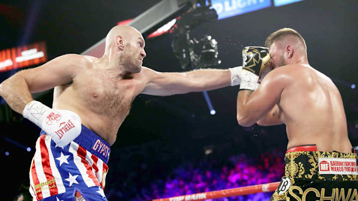 Tyson Fury Stays Unbeaten, Stops Tom Schwarz Late Second Round Tyson Fury Stays Unbeaten, Stops Tom Schwarz Late Second Round