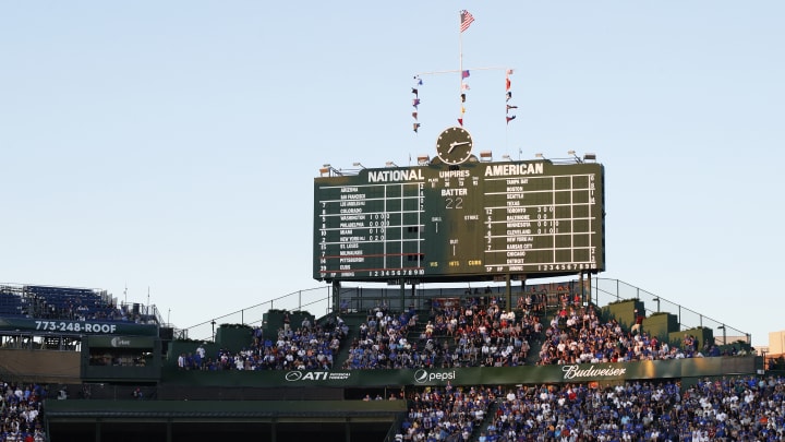 Fan Wearing Bucket on His Head Spared From Serious Injury by Falling Scoreboard Tile
