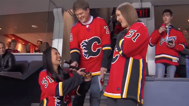 Monday's Hot Clicks: Two Women Visit Every NHL Arena and Get Engaged On the Final Stop