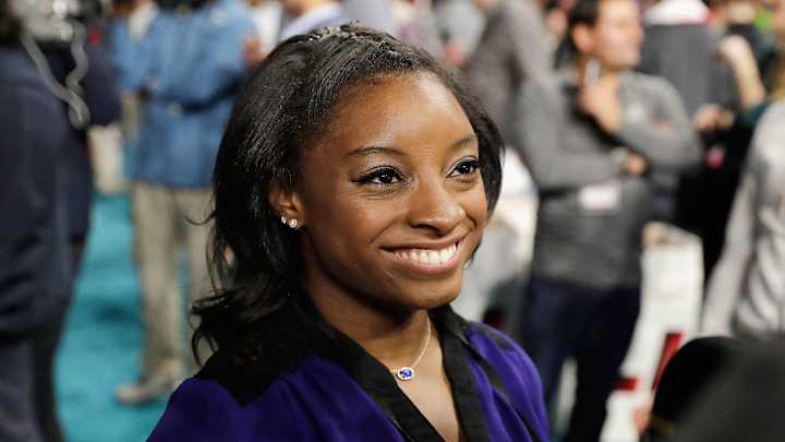 Simone Biles interviewed a Falcons player who is two feet taller than she is