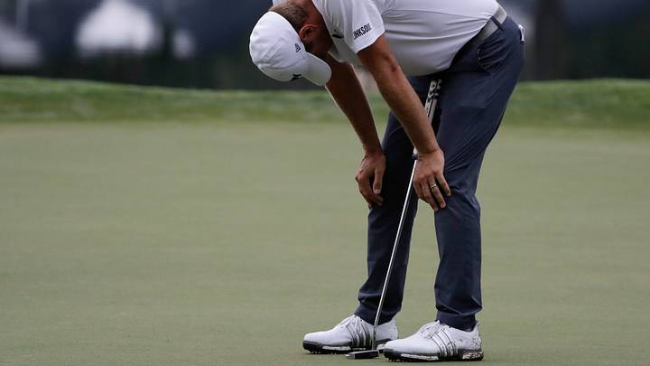 Glover injures right knee when foot slips on 18th fairway