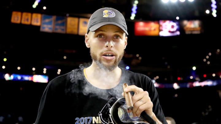 WATCH: Stephen Curry smokes victory cigar on live television after saving it for a year WATCH: Stephen Curry smokes victory cigar on live television after saving it for a year
