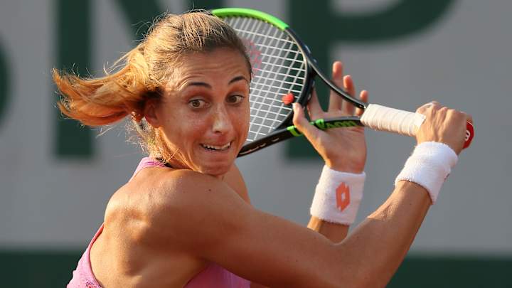 Martic fights back from injury to reach French Open fourth round