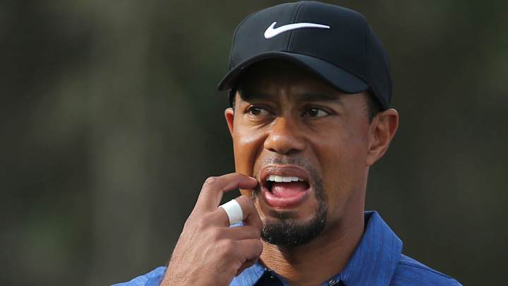 Back spasms force Woods to withdraw from news conference
