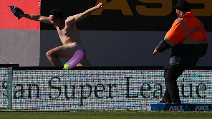 Video: Cricket streaker’s near escape foiled by tumble over wall