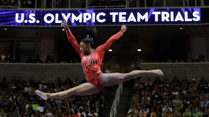 Olympic champ Simone Biles back in gym as she weighs options