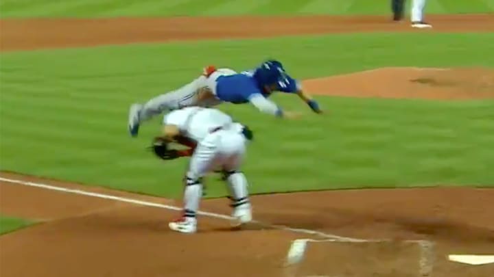 Watch: Chris Coghlan flies over Yadier Molina to avoid tag at home Watch: Chris Coghlan flies over Yadier Molina to avoid tag at home