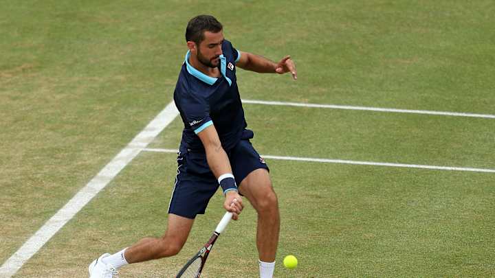Lopez saves match point, beats Cilic in Queen's final