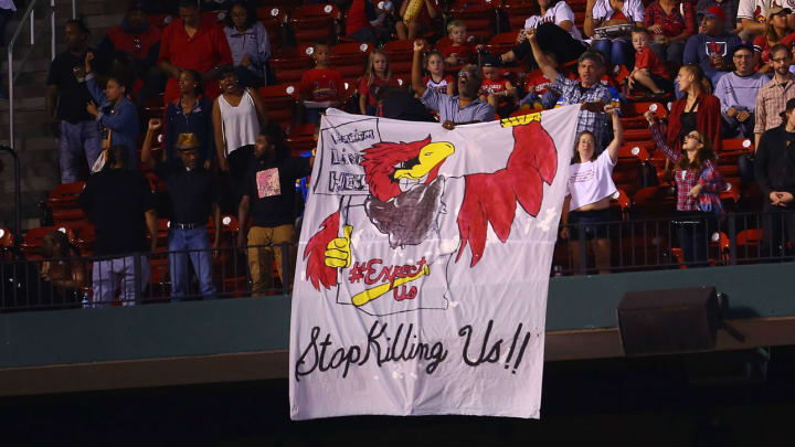 Protestors Hold 'Stop Killing Us' Sign at Busch Stadium Protestors Hold 'Stop Killing Us' Sign at Busch Stadium