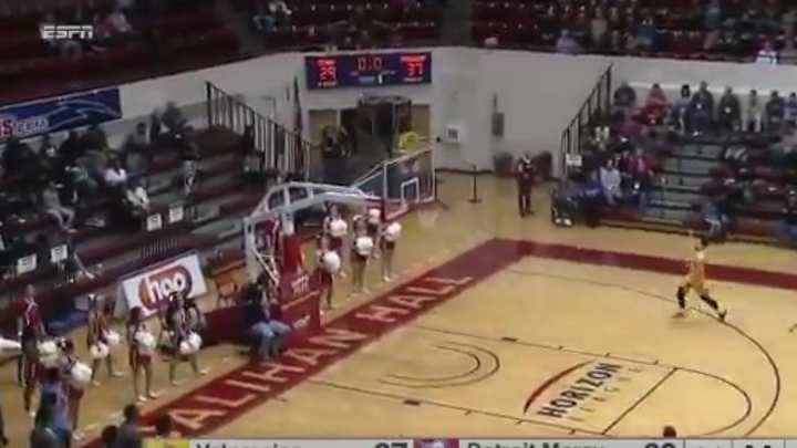 Three-quarter court heave impossibly goes in after hitting top of shot clock