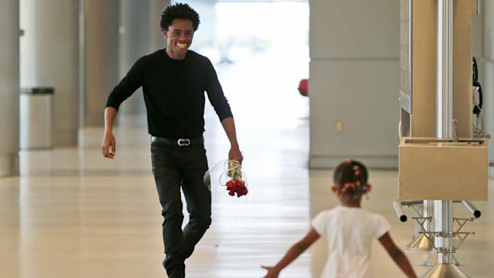Ethiopian marathoner Feyisa Lilesa reunited with his family after months apart