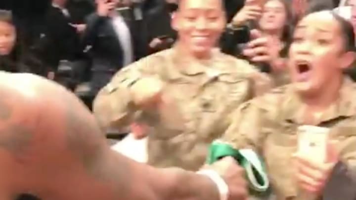 Watch: Kyrie Irving Gives Game-Worn Jersey, Shoes to Military Personnel