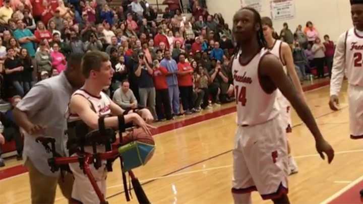 Watch: High school team lets fan deliver assist of a lifetime
