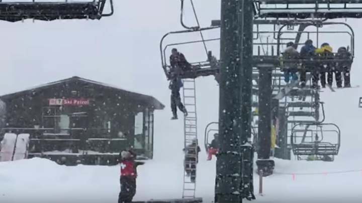 Chilling rescue of boy dangling from ski lift caught on tape