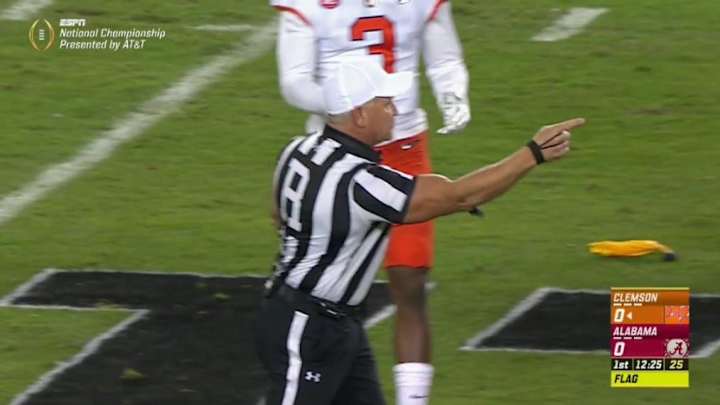 The lead referee in the national championship game is totally jacked
