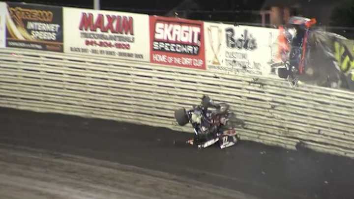 Video: Sprint car driver emerges unharmed after flying over wall