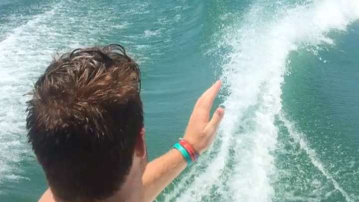 Watch: Sam Darnold even throws darts from a moving boat