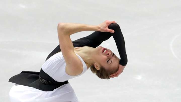 Medvedeva wins short program, Kostner places third