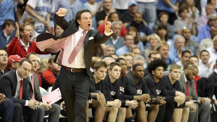 Rick Pitino restrained after verbal exchange with UNC fan
