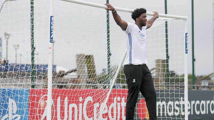 Joel Embiid wasn’t allowed to play in this soccer game, so he just stood in the goal and watched