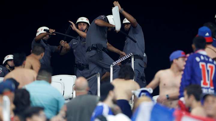 Chilean fans rip out seats to throw at police at Brazil's Arena Corinthians