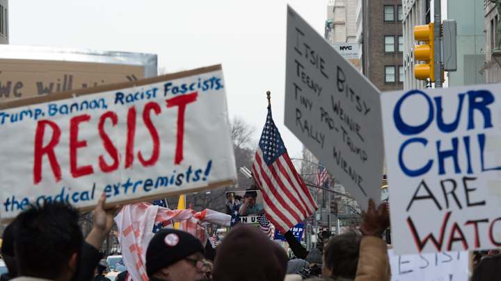 Anti-Trump protesters gather near NRG Stadium before Super Bowl