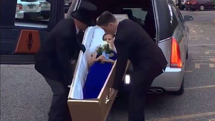 New Jersey teen rolls into high school prom in hearse and casket