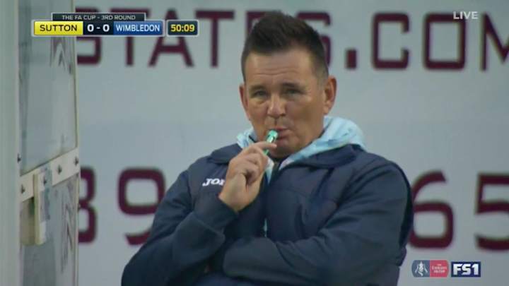 This manager appears to be vaping on the FA Cup sidelines