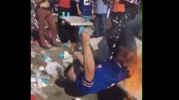 Watch: Bills Fan On Fire After Breaking Burning Table At Tailgate