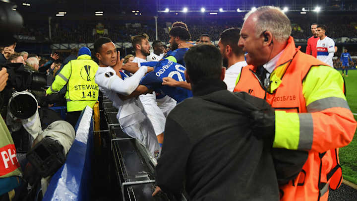 VIDEO: Man Holding Child Among Everton Fans Attacking Lyon Players During Mass Brawl in Europa Clash
