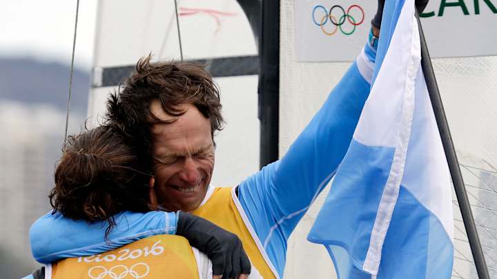 Tearful Argentine cancer survivor wins sailing gold at 54 Tearful Argentine cancer survivor wins sailing gold at 54