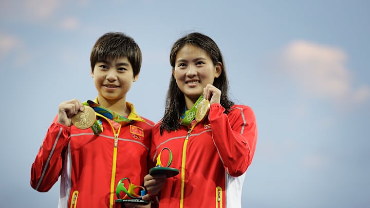 Green, not gold, color of day at Olympic diving pool