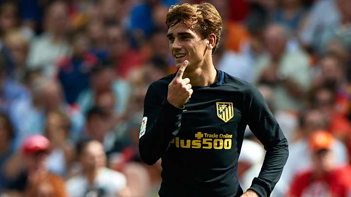 Atletico moves into La Liga lead after Madrid and Barcelona stumble