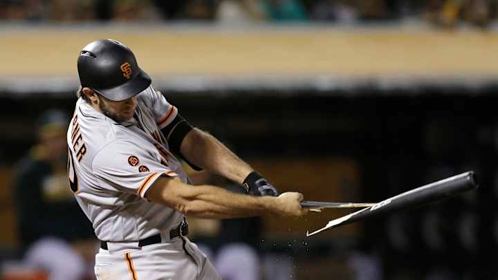 Bumgarner pitches Giants to win and swings the bat, too