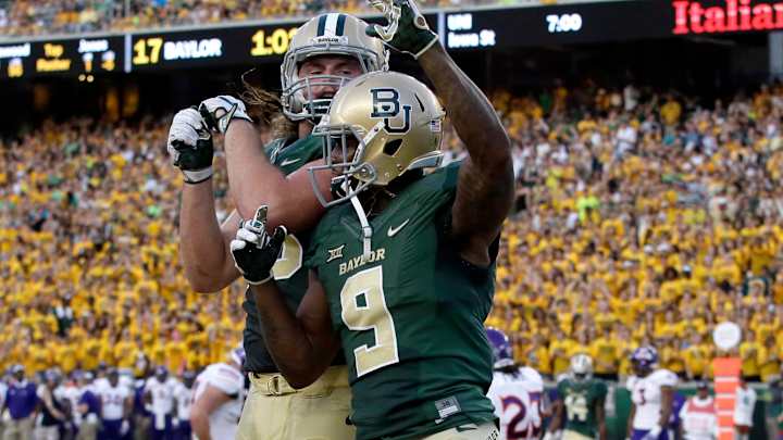 Russell 4 TD passes, No. 23 Baylor rolls 55-7 over Demons
