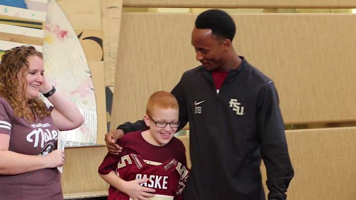 FSU’s Travis Rudolph gives Bo Paske personalized Seminoles jersey