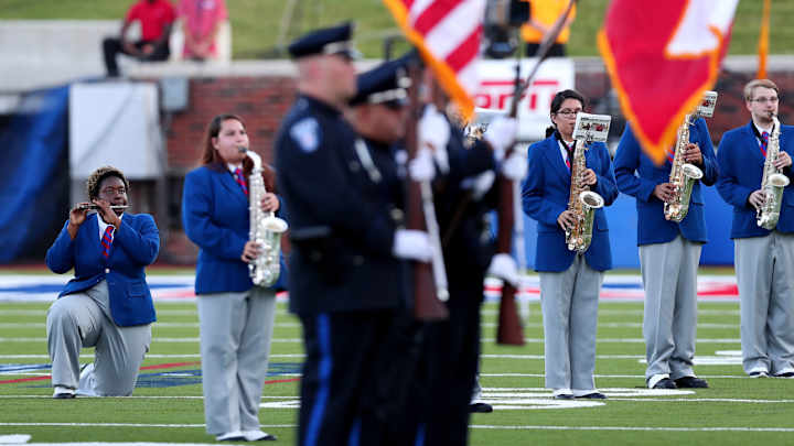 SMU band members kneel in protest during national anthem SMU band members kneel in protest during national anthem