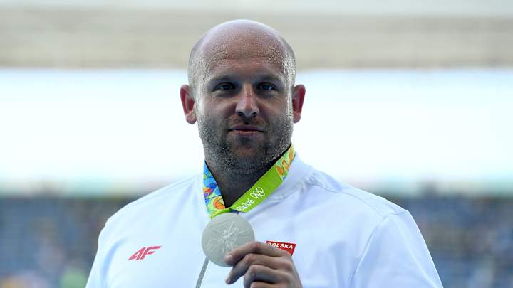 Polish discus thrower auctions silver medal to help fund child’s cancer treatment Polish discus thrower auctions silver medal to help fund child’s cancer treatment