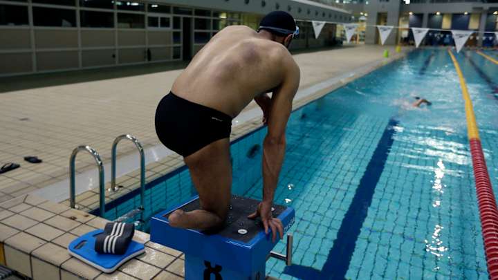 Still swimming in exile, Syrian refugee to carry Rio flame