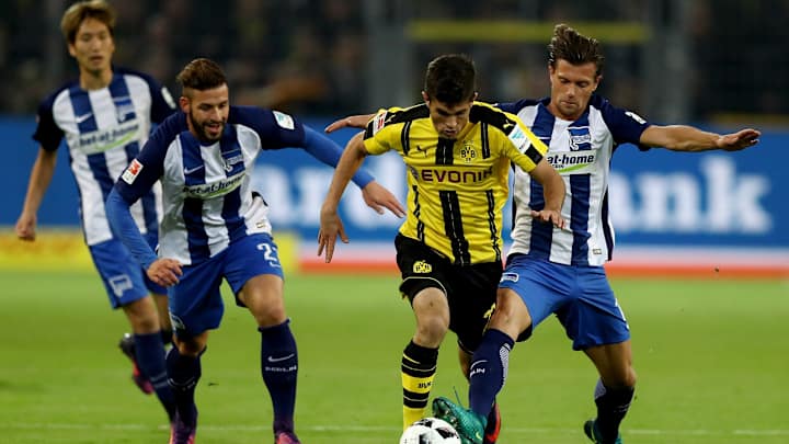 Aubameyang helps Dortmund draw Hertha Berlin; both end with 10 men