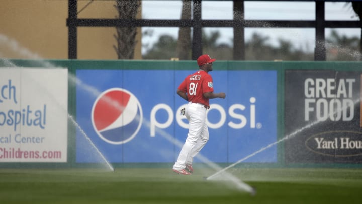 Wainwright wilder than usual in spring debut, Cards top Mets