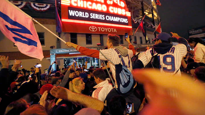 The Latest: Chicago native Clinton watches Cubs victory