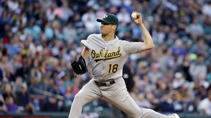 Hill strikes out 10, Reddick homers and A's beat Mariners