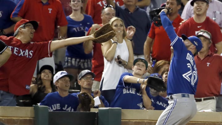 Rangers extend safety netting over dugouts at stadium