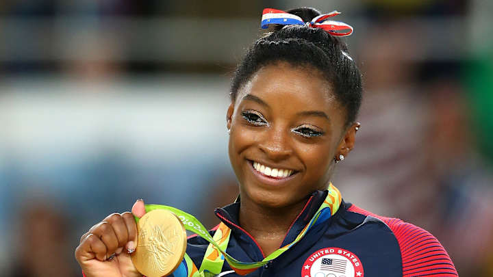 Simone Biles plays dead after kiss (on the cheek!) from Zac Efron