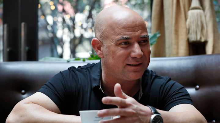 10 years after last pro match, Andre Agassi visits US Open